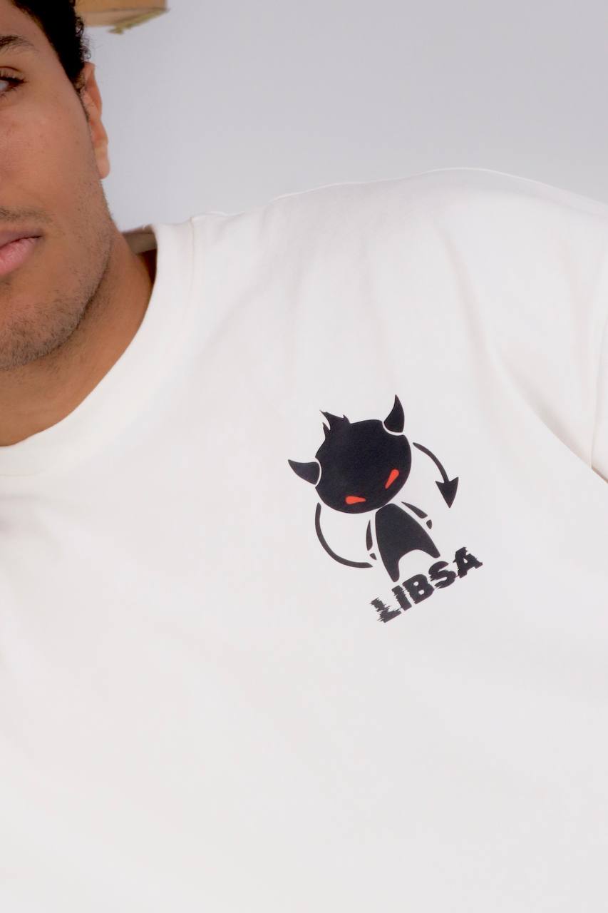 Person wearing a white t-shirt with a black and red logo on a plain background