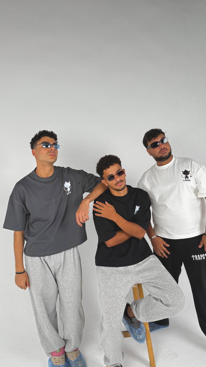 Three men posing together against a white background