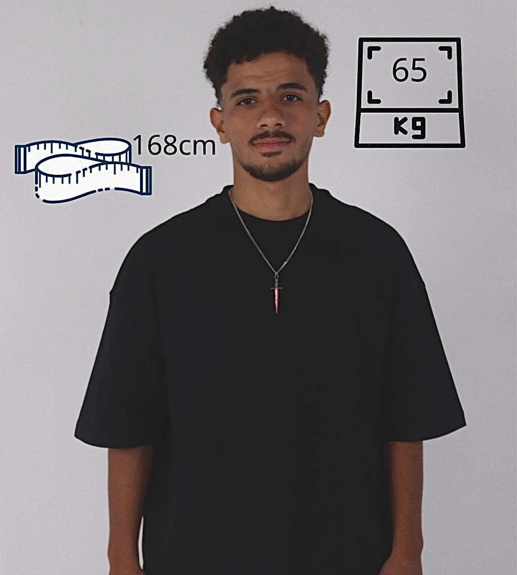 Man wearing a black t-shirt with height and weight measurements displayed on a gray background